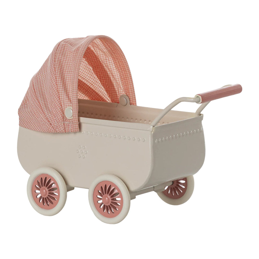 Toy pram with a pink checkered canopy on a white background