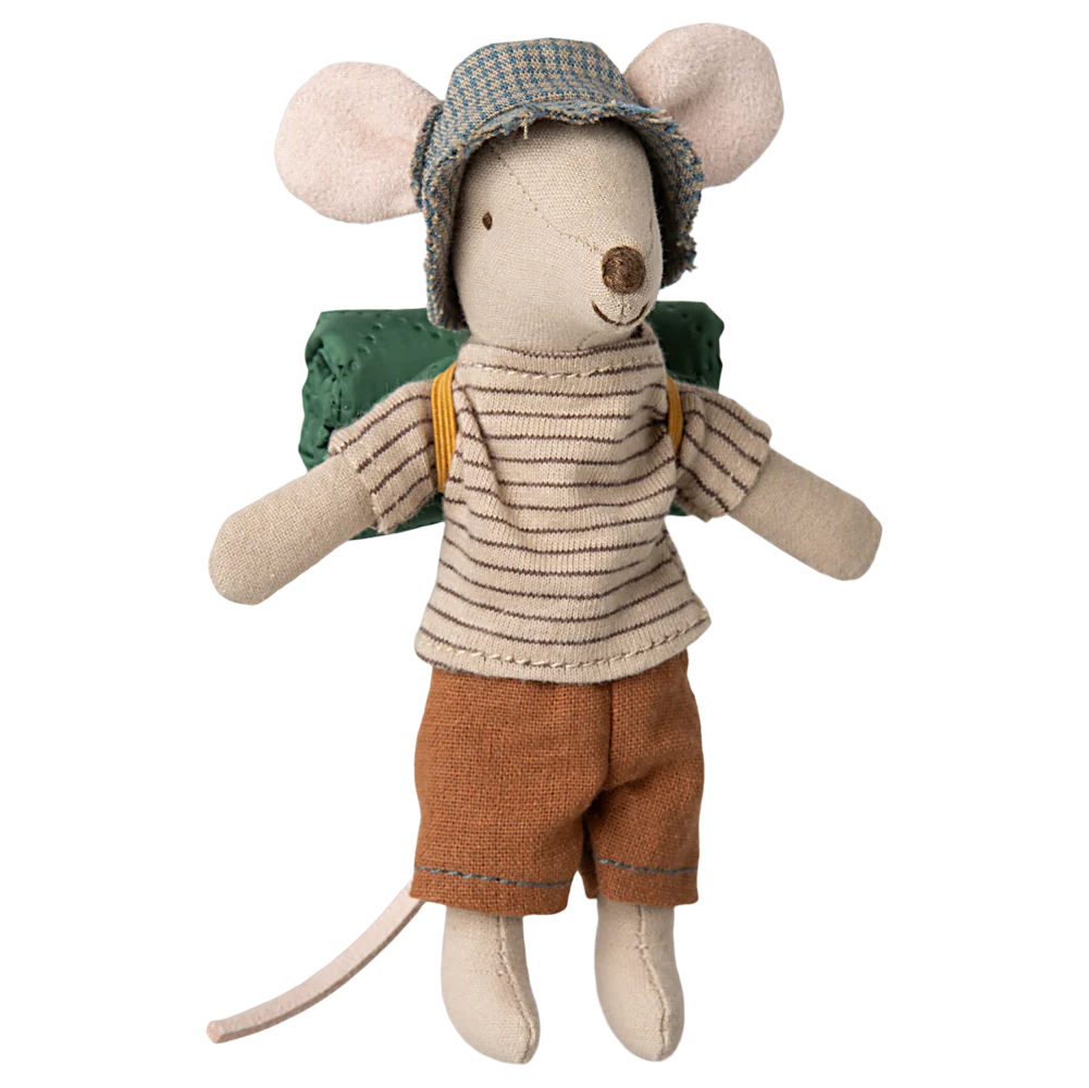 A toy mouse dressed in a striped shirt, brown pants, and a green backpack, wearing a hat with thin stripes.