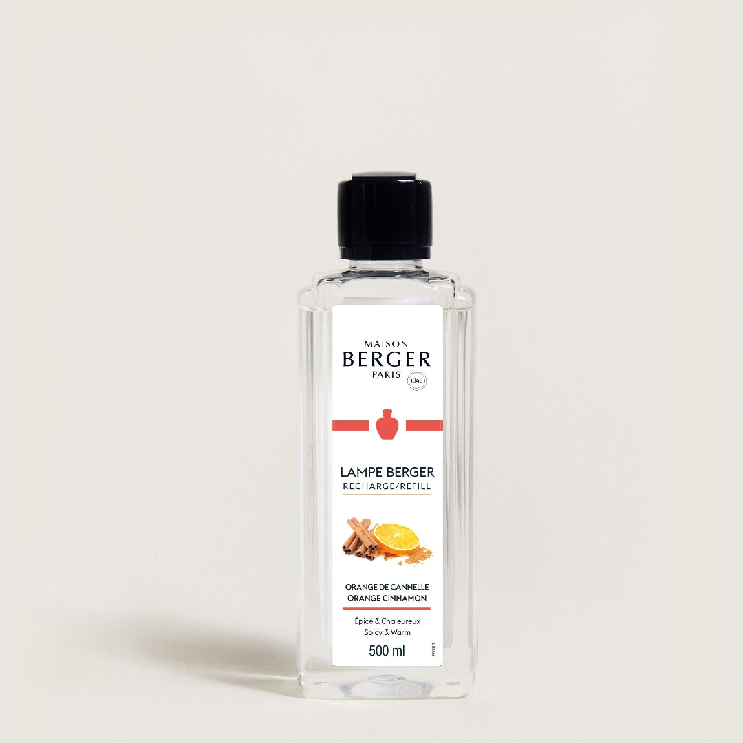 Bottle of Maison Berger lamp refill on a light gray background