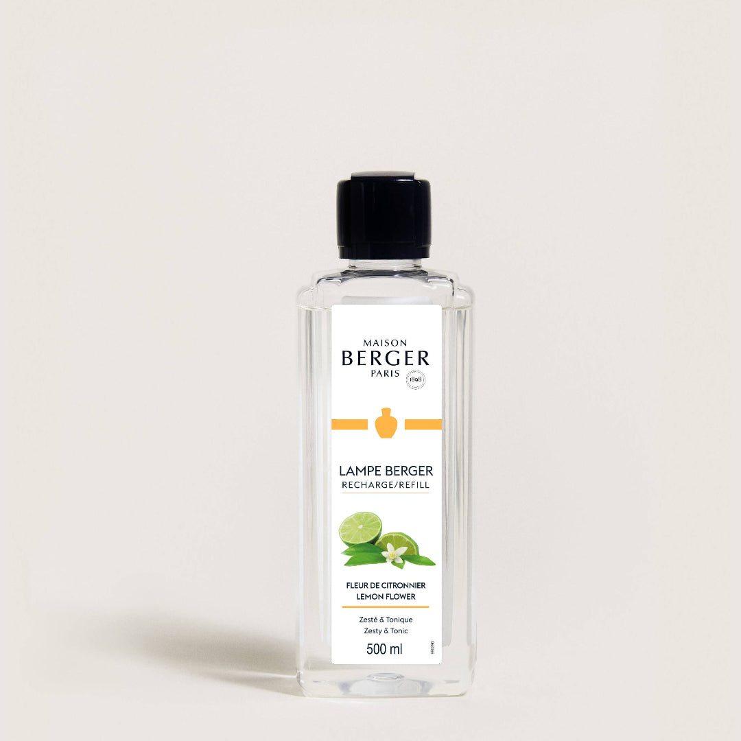 Bottle of Maison Berger lamp refill on a light background
