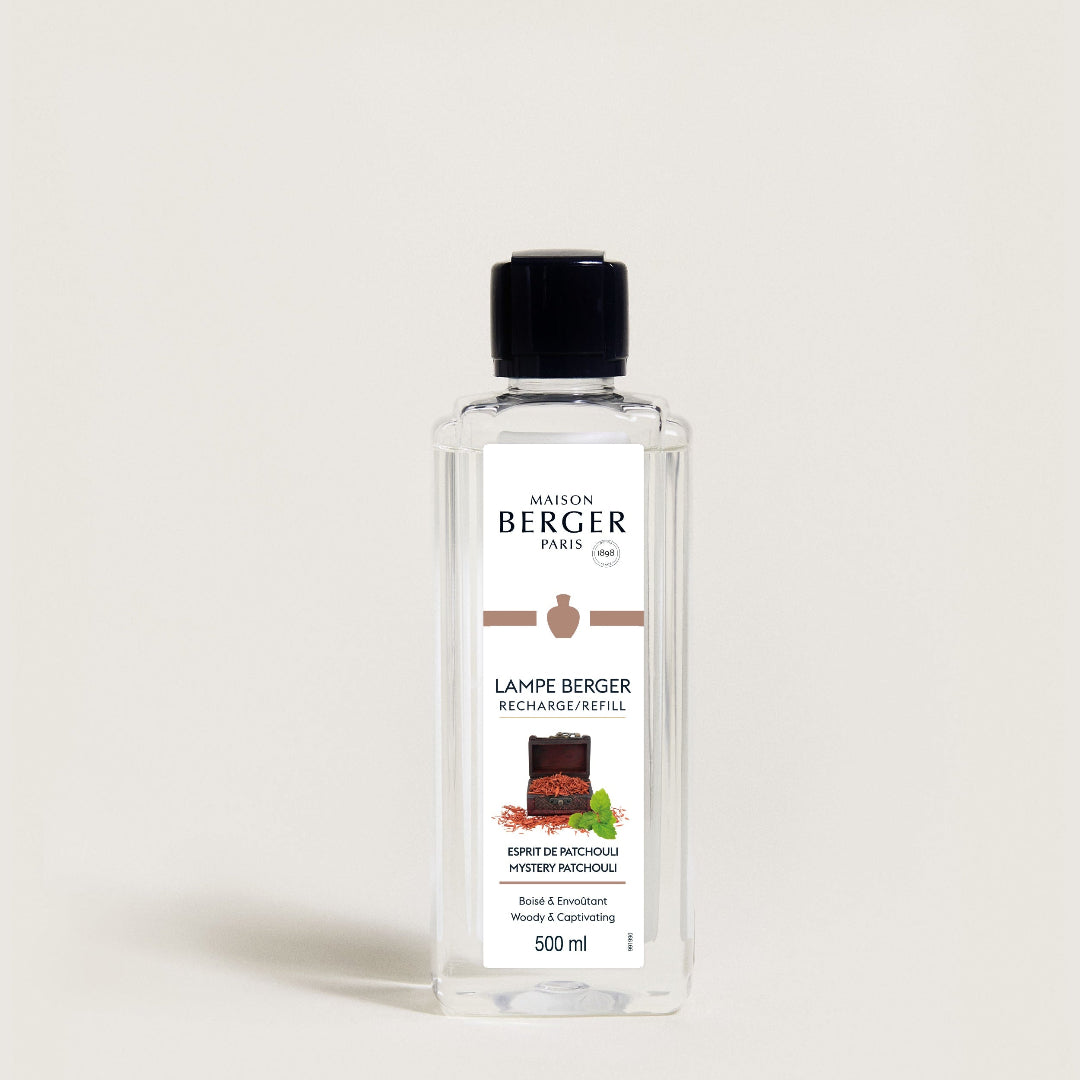 Bottle of Maison Berger lamp refill on a light beige background