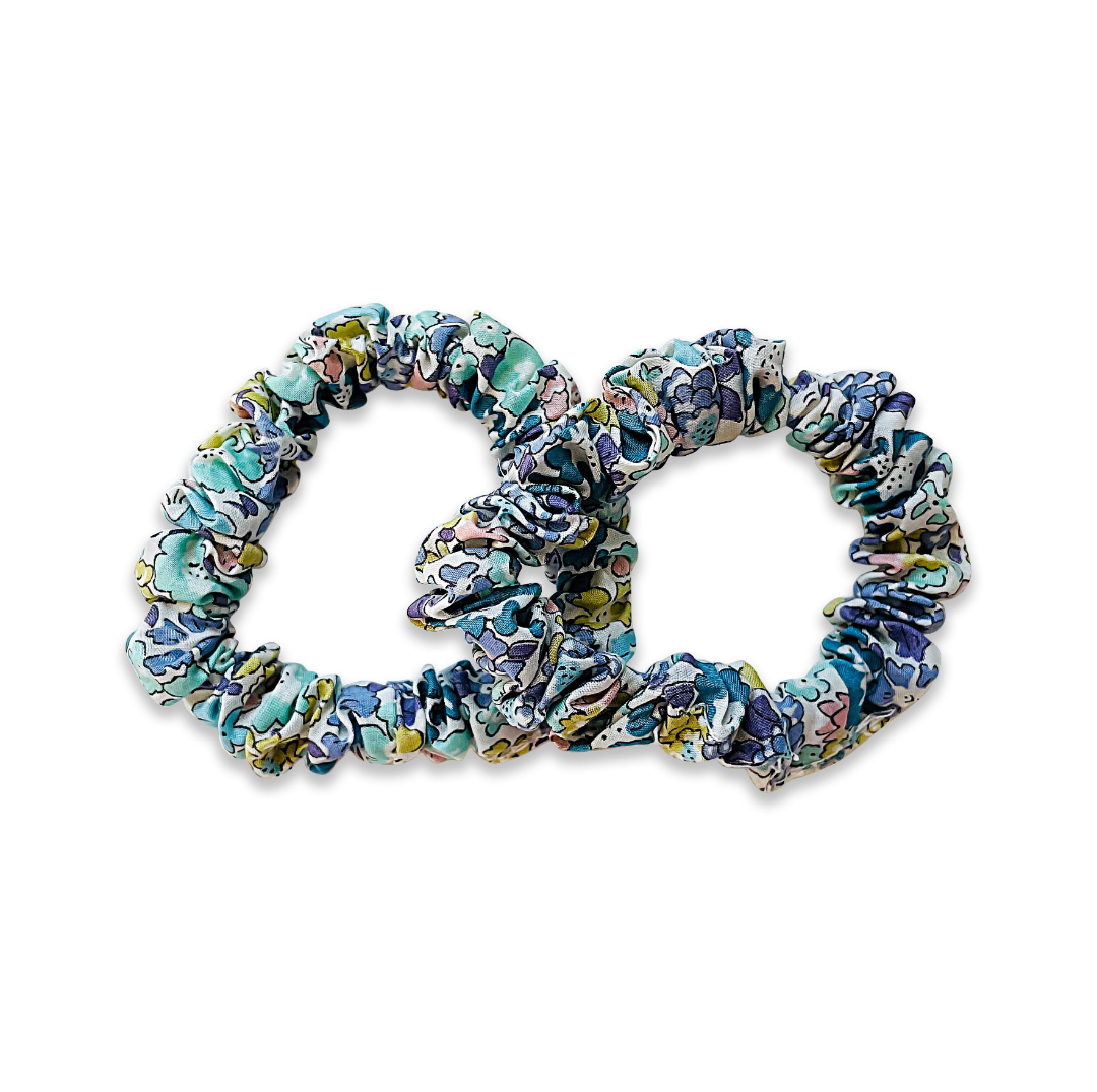 Set of floral scrunchies on a white background