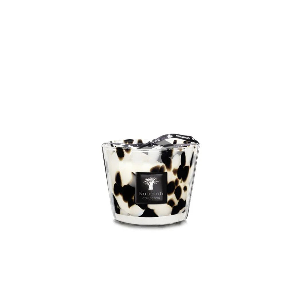 A collection of Baobab Black Pearls scented candles in various sizes, featuring a black and white patterned design, placed in transparent glass holders.