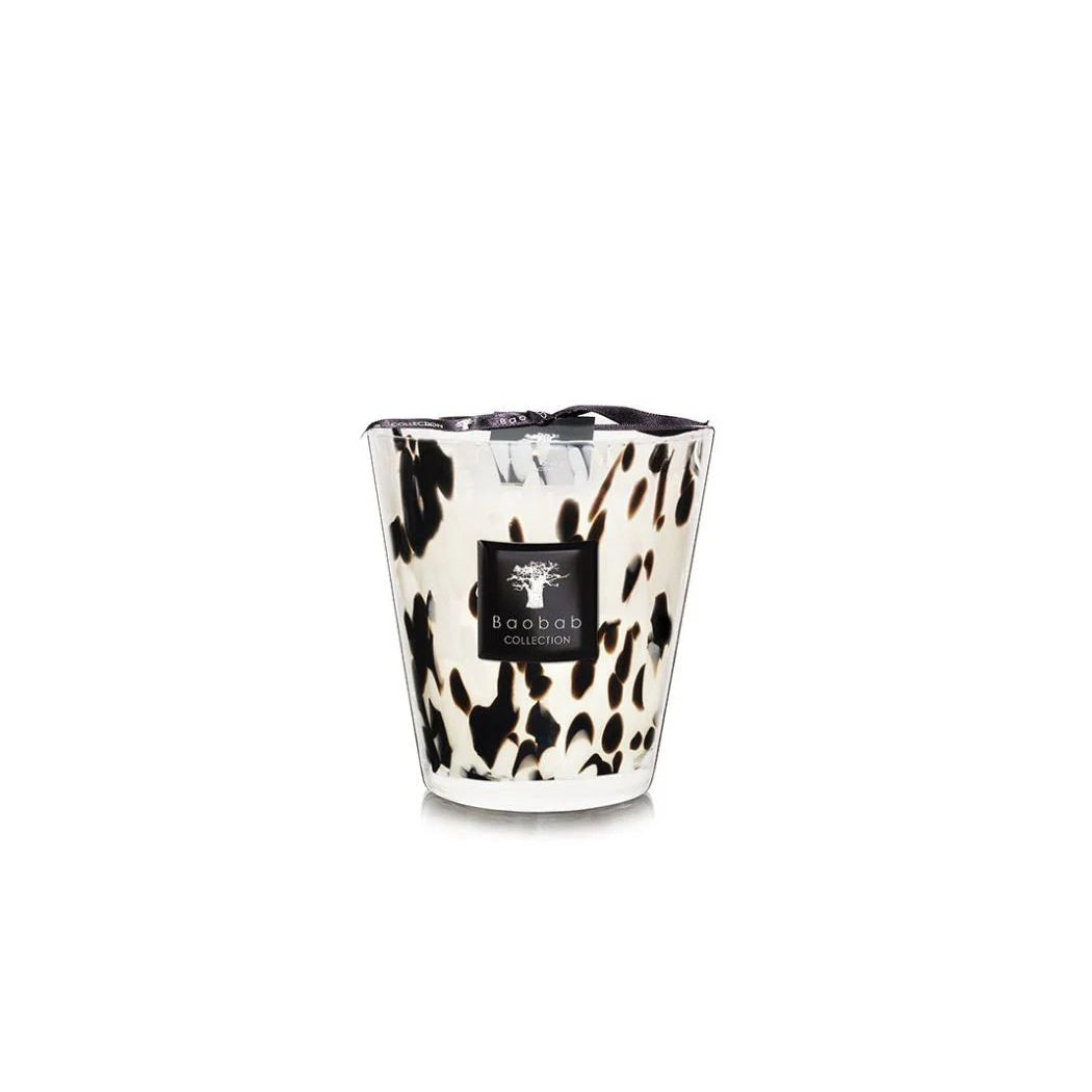 A collection of Baobab Black Pearls scented candles in various sizes, featuring a black and white patterned design, placed in transparent glass holders.