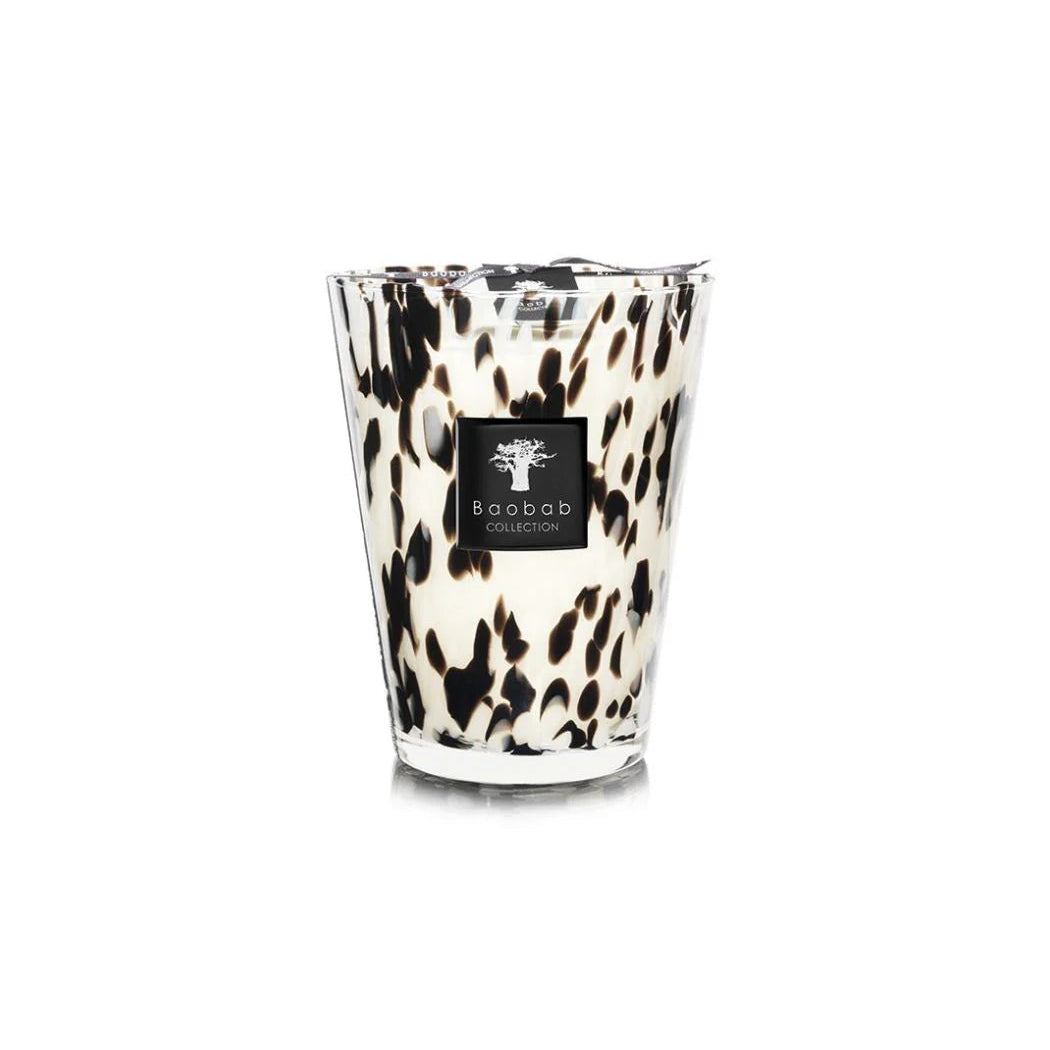 A collection of Baobab Black Pearls scented candles in various sizes, featuring a black and white patterned design, placed in transparent glass holders.