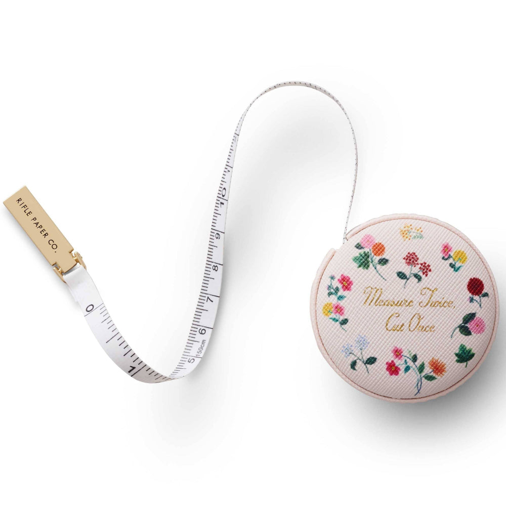 Tape measure with floral design on a white background