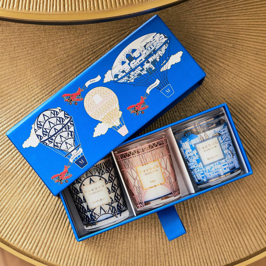 Blue gift box with decorative elements on a wooden surface