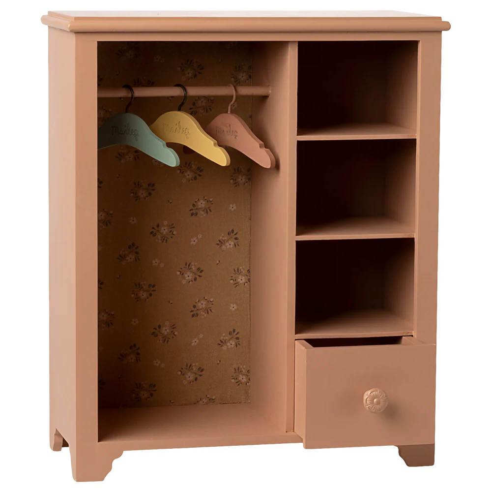 Wooden wardrobe with colorful hangers on a white background