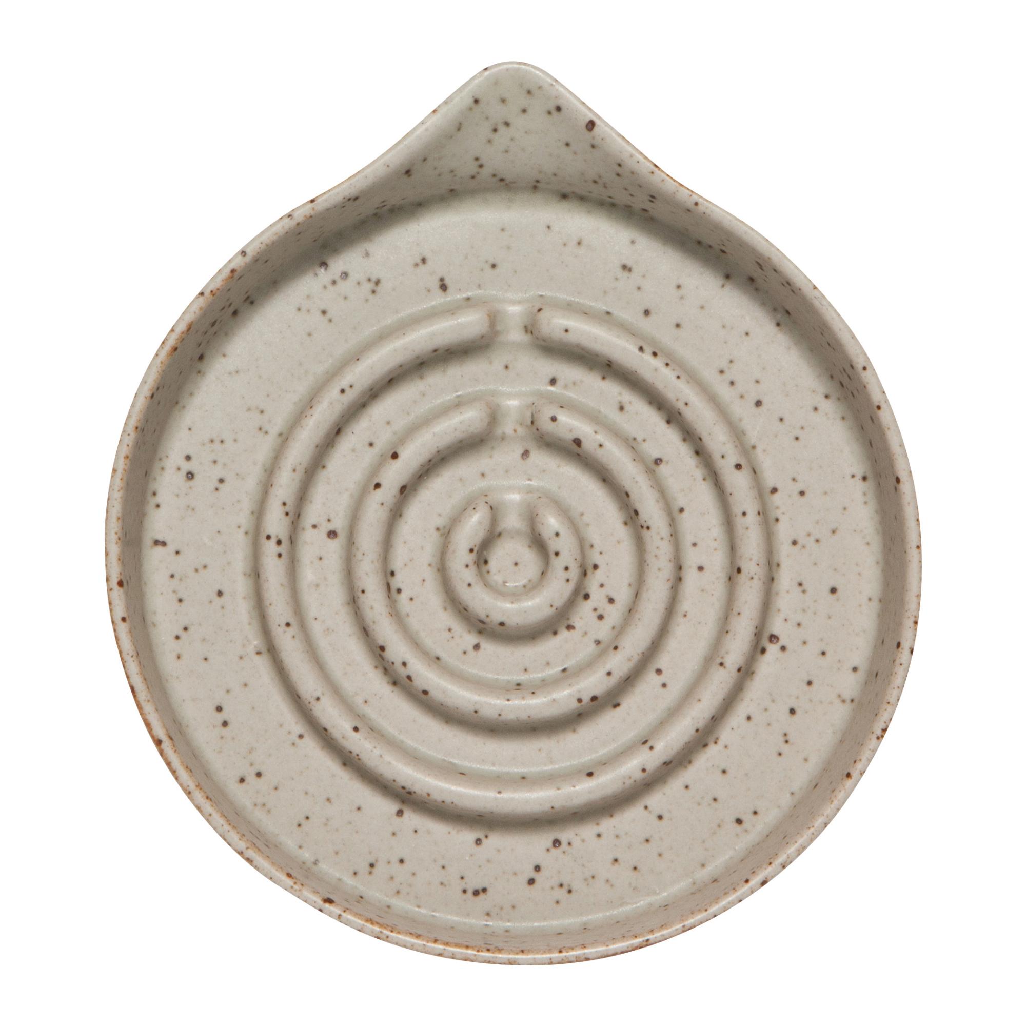 Ceramic plate with spiral design on a white background