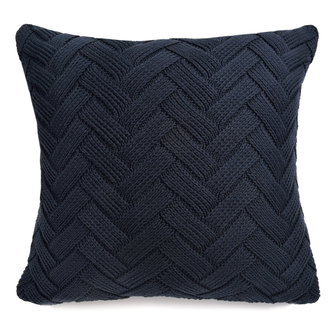 A navy throw pillow with a classic herringbone pattern.