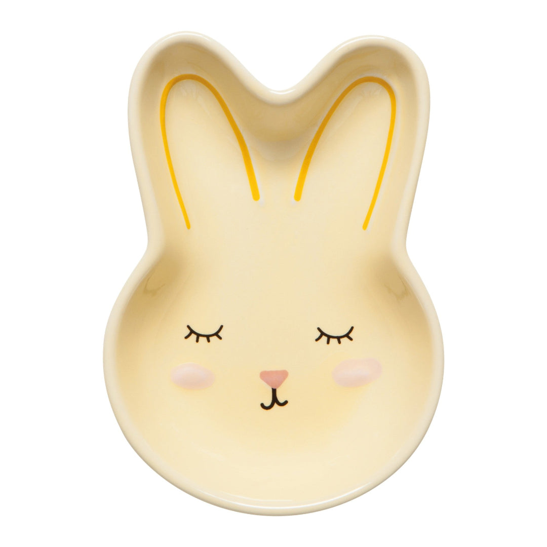Bunny-shaped bowl with a face on a white background