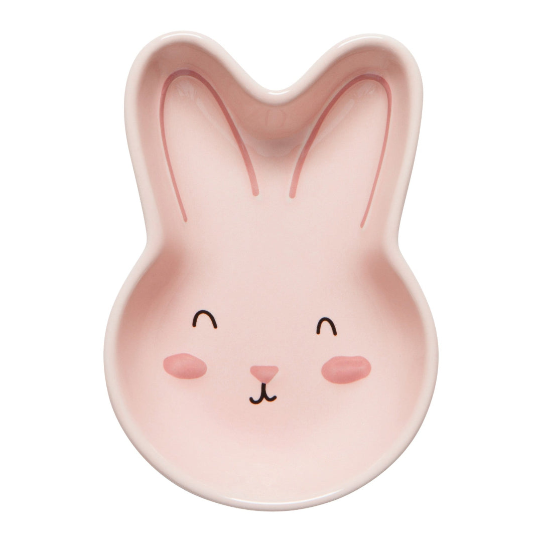 Pink bunny-shaped dish with a face on a white background
