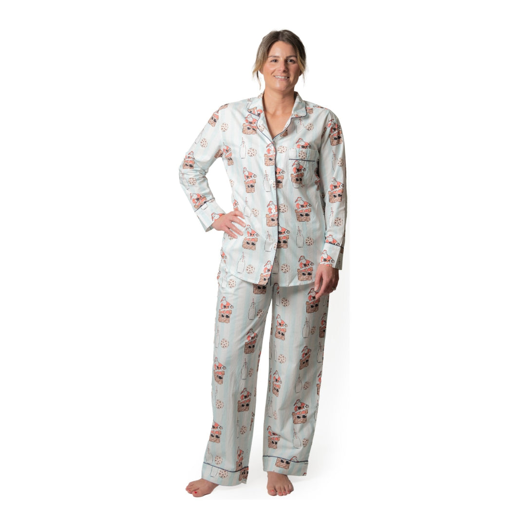 Woman wearing a holiday pajama set on a white background