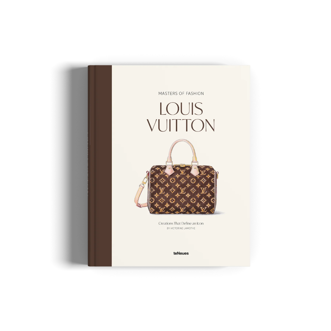 A hardcover book titled 'Masters of Fashion Louis Vuitton'
The book features a cream-colored cover with a brown monogram Louis Vuitton handbag illustration in the center, a dark brown spine, and a brown vertical stripe on the left side.