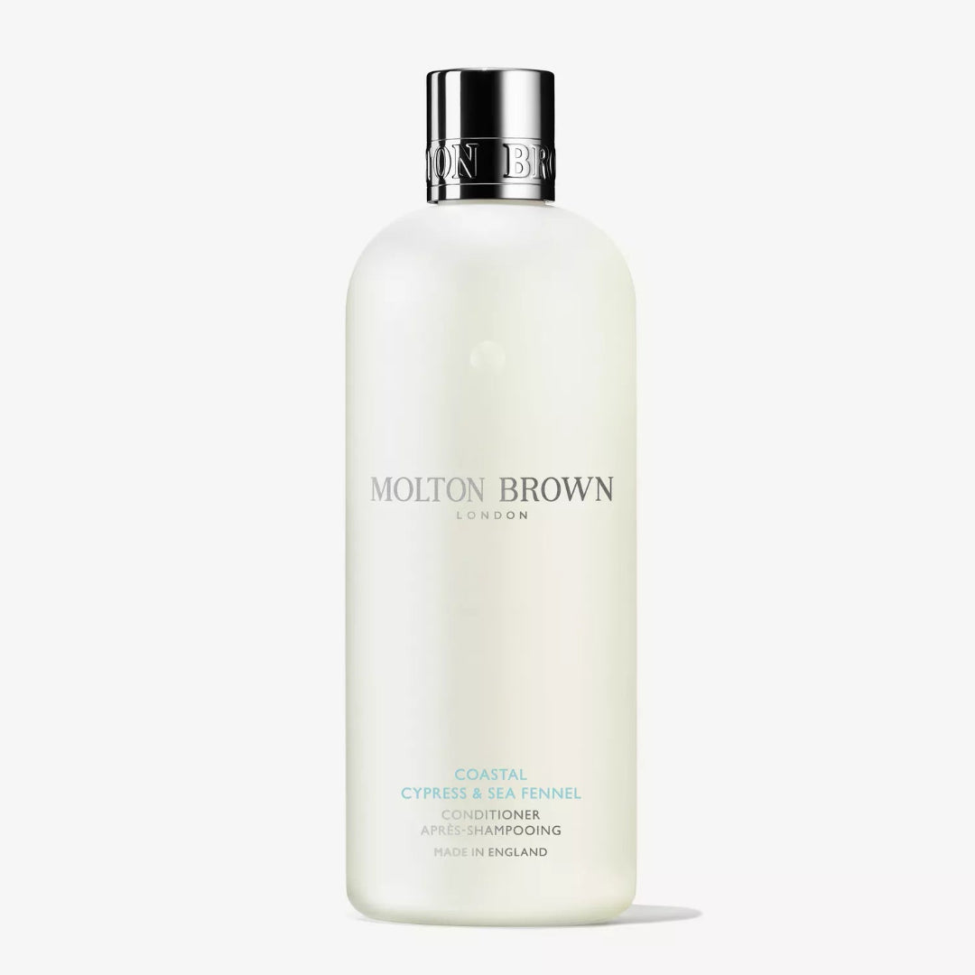 Molton Brown conditioner bottle on a white background