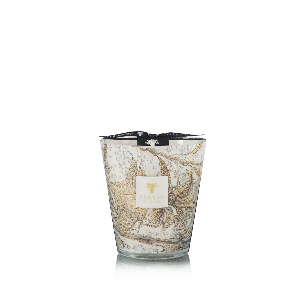 Candle in hand blown glass on a white background