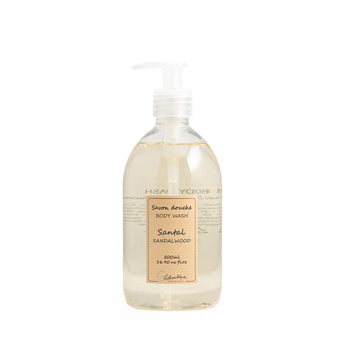 A clear pump bottle of Authentique Sandalwood Body Wash with a label that includes the product name and a description as 'Santal Elaboration'.