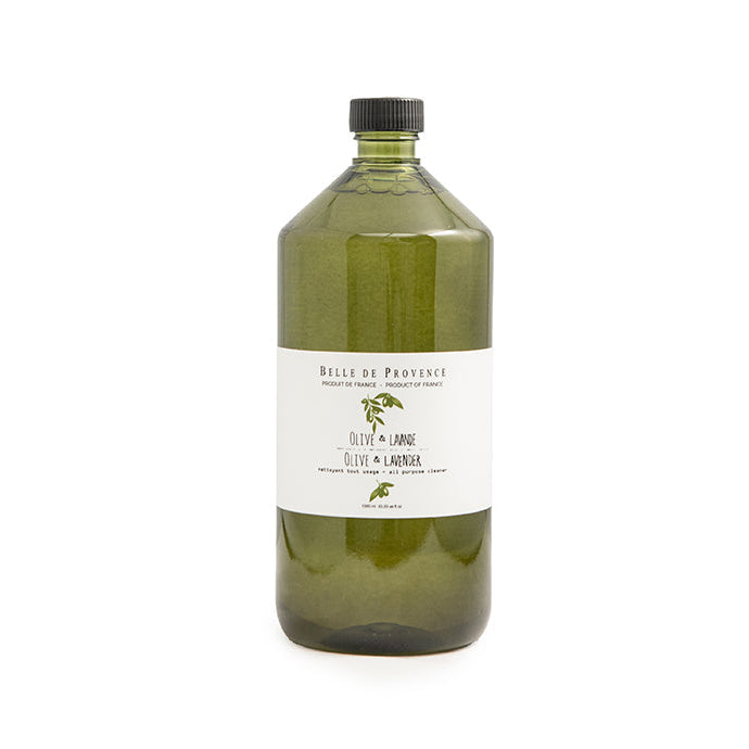 Green bottle with a label on a white background