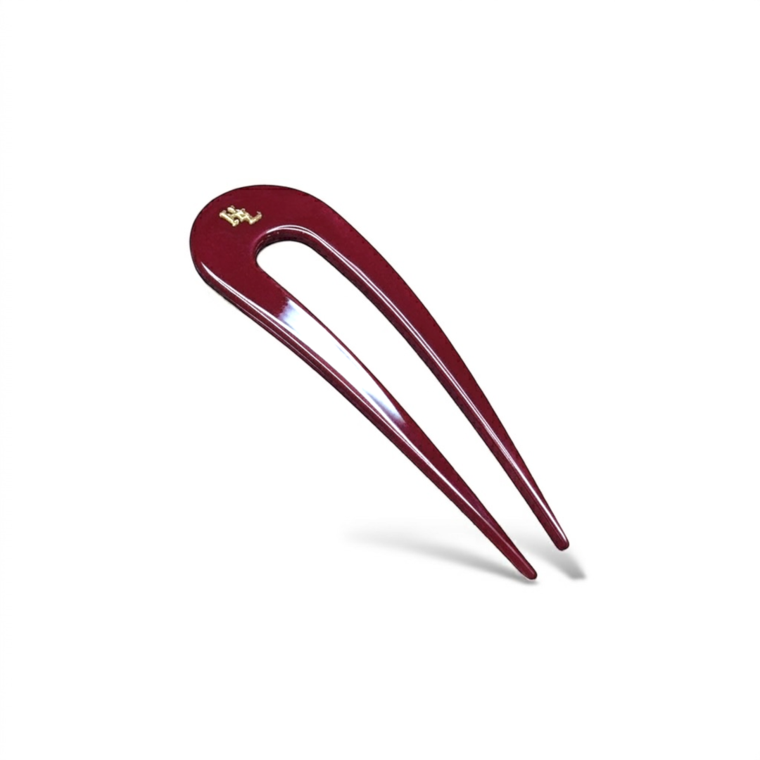Rouge hairpin with logo on a white background