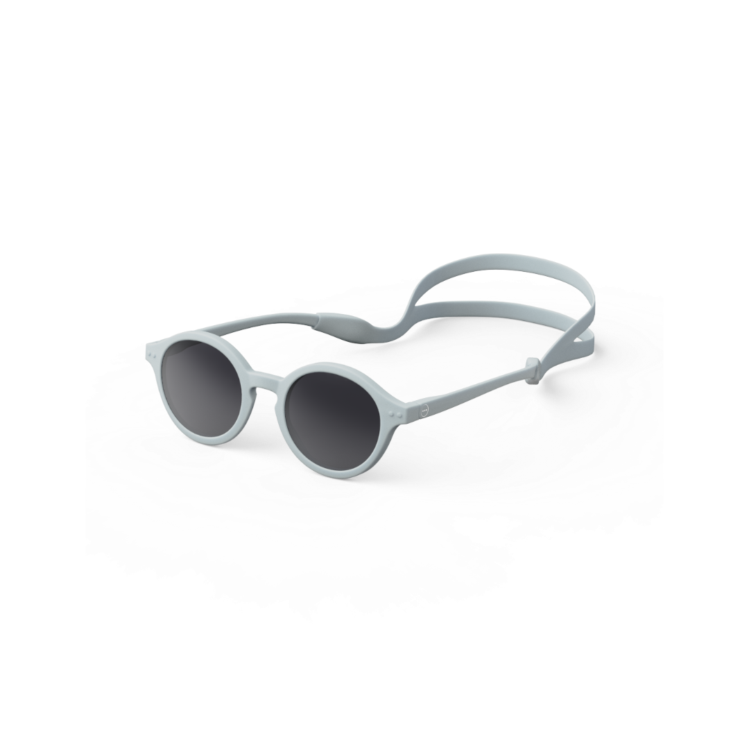 A pair of IZIPIZI kids' sunglasses in Aqua Green color with a round shape and straight arms, featuring a removable silicon strip for hold.