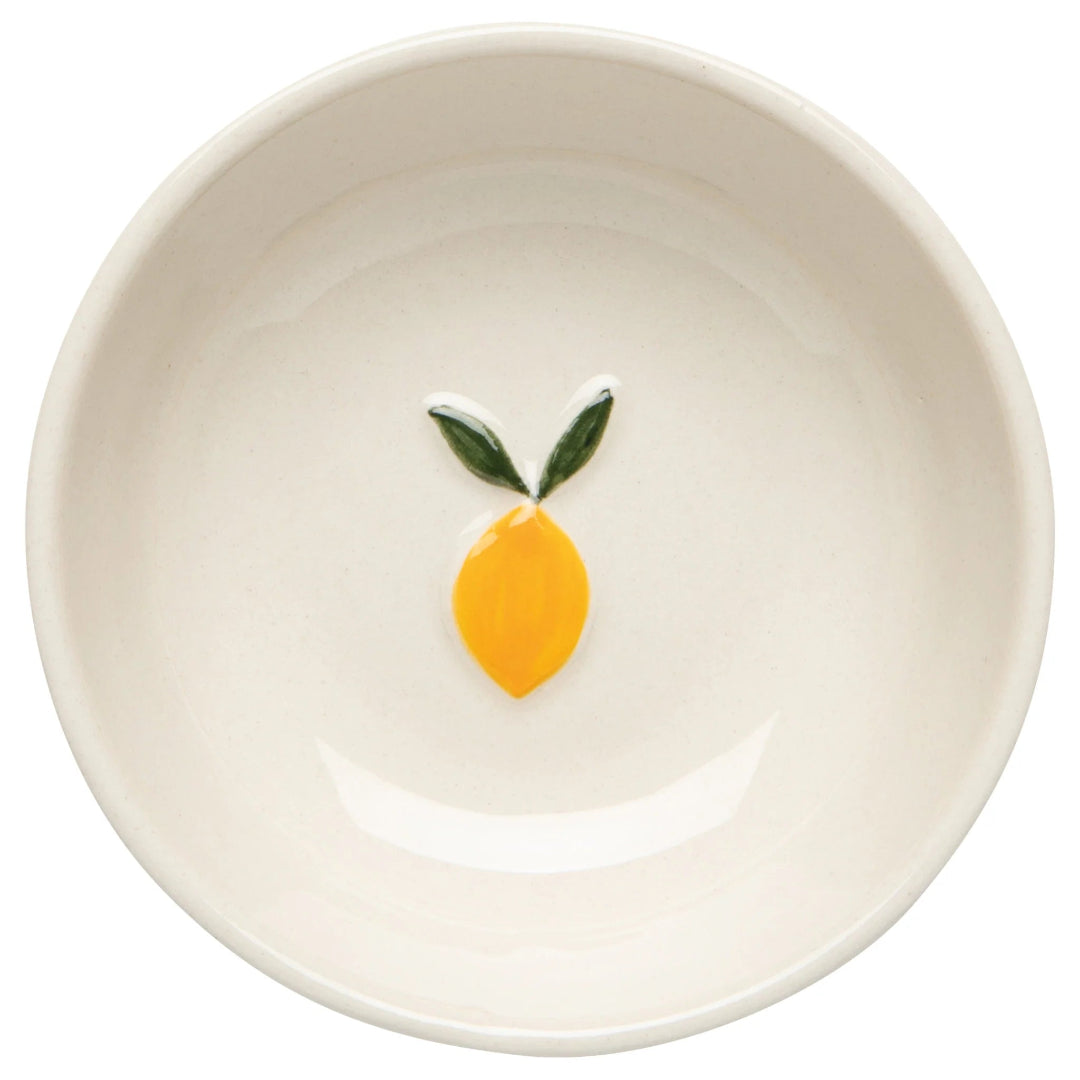 White ceramic bowl with a lemon design on a white background