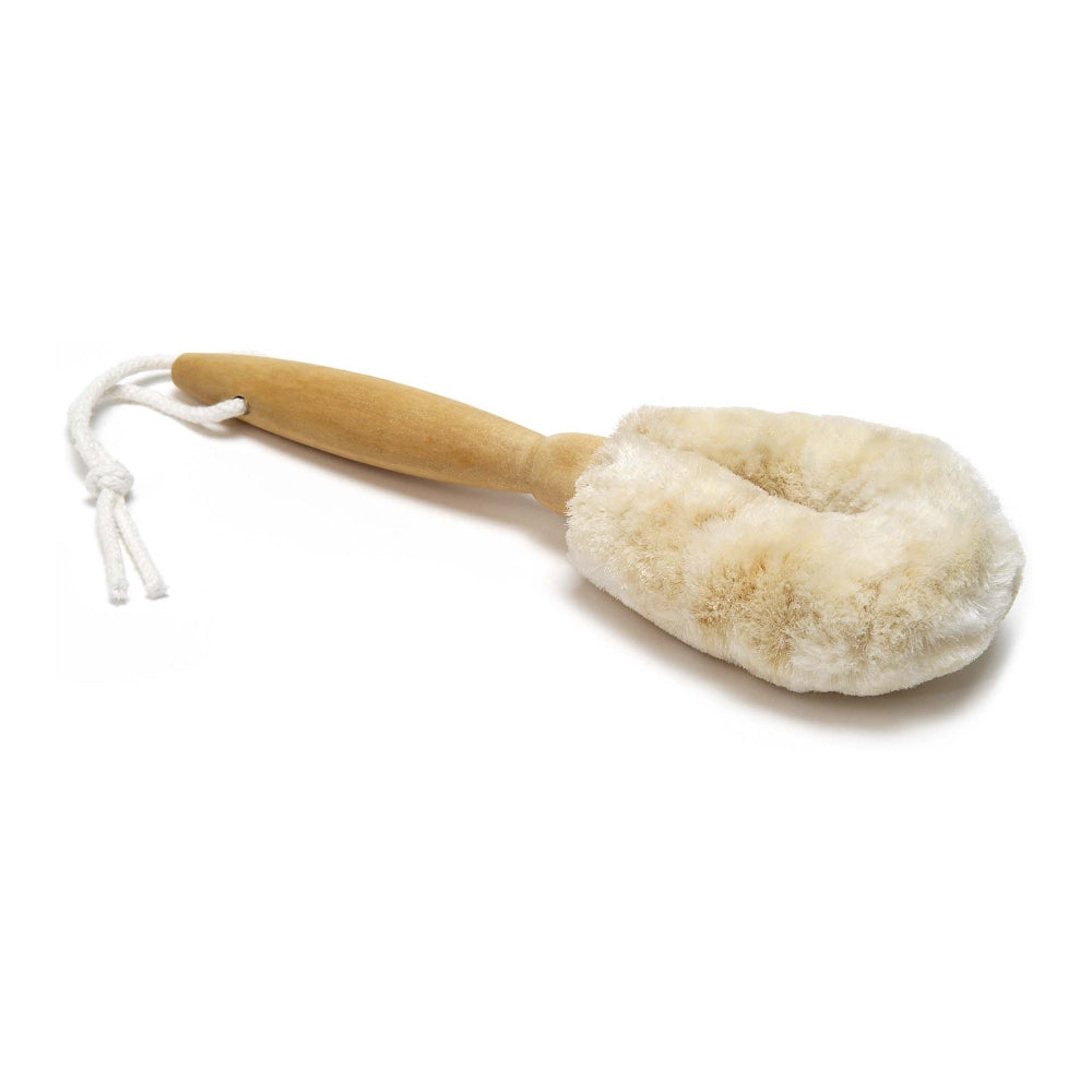 Body brush with natural bristles and wooden handle on a white background