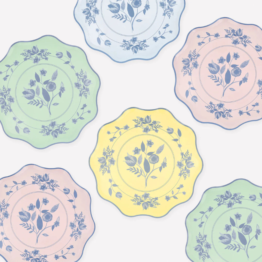 Pastel-colored plates with floral patterns on a white background