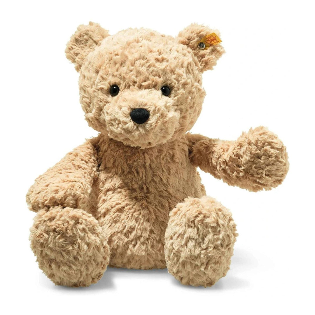 Beige teddy bear on a white background