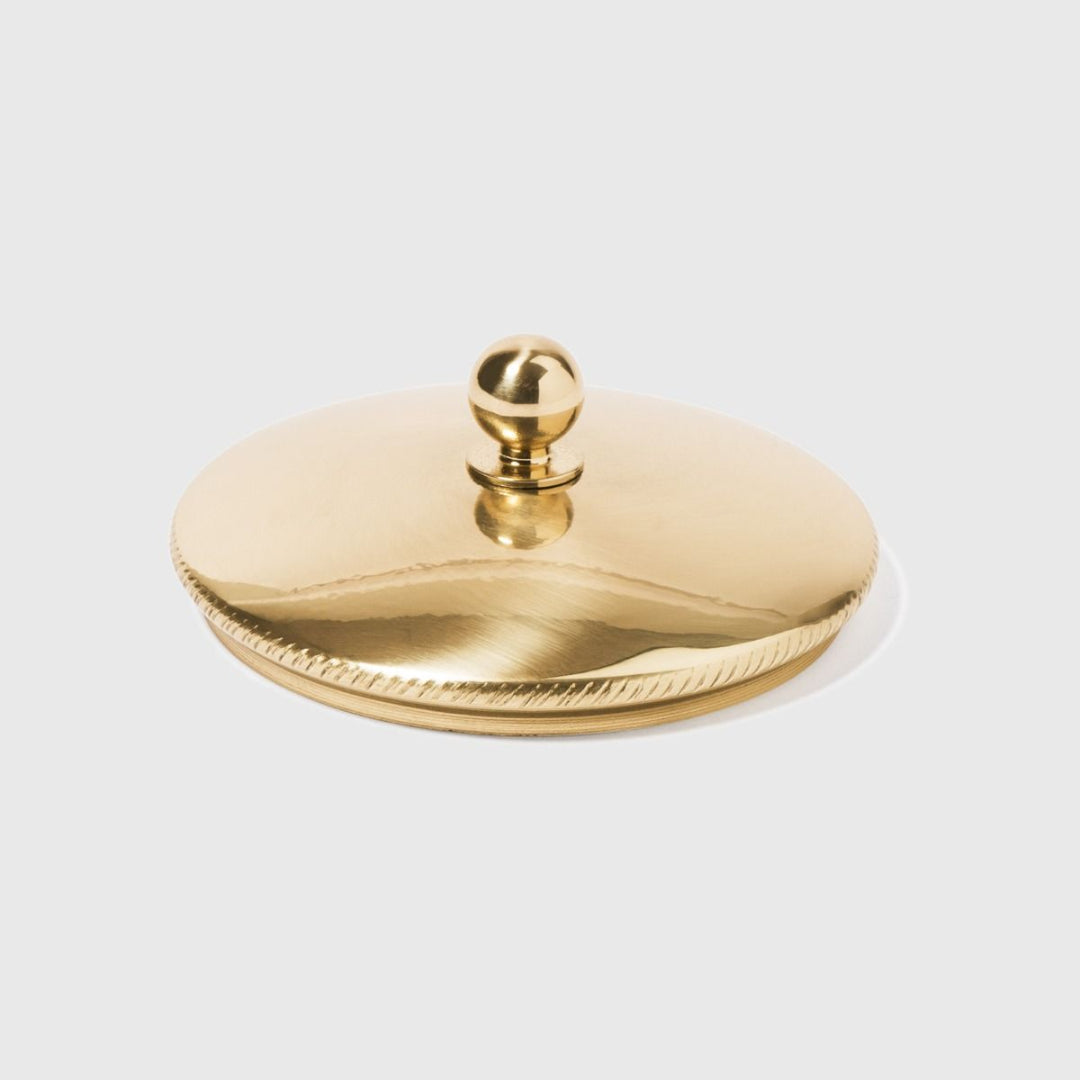 Gold decorative lid on a white background