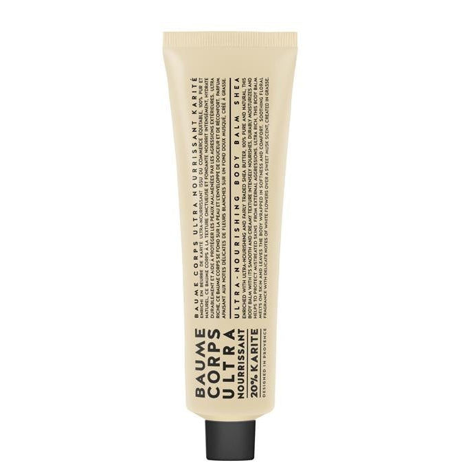 A tube of Nourishing Shea Body Balm with text on the label, predominantly in a beige color.