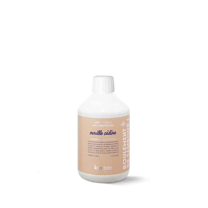 A bottle of Kerzon Maille Câline laundry soap for wool & delicates, with a pink label, against a white background.