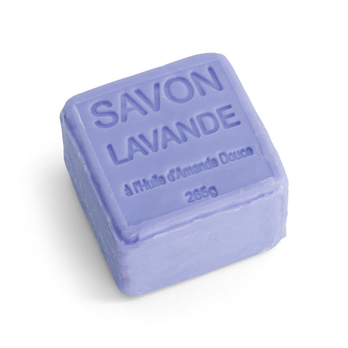 A purple cube soap with 'SAVON LAVANDE' embossed on it, indicating it is a lavender-scented soap from Provence.