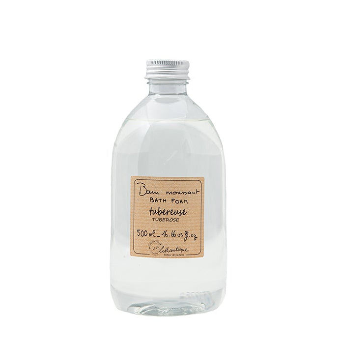 A clear plastic bottle with a label displaying 'Authentique Tuberose Foam Bath', indicating the product is 500mL in size.