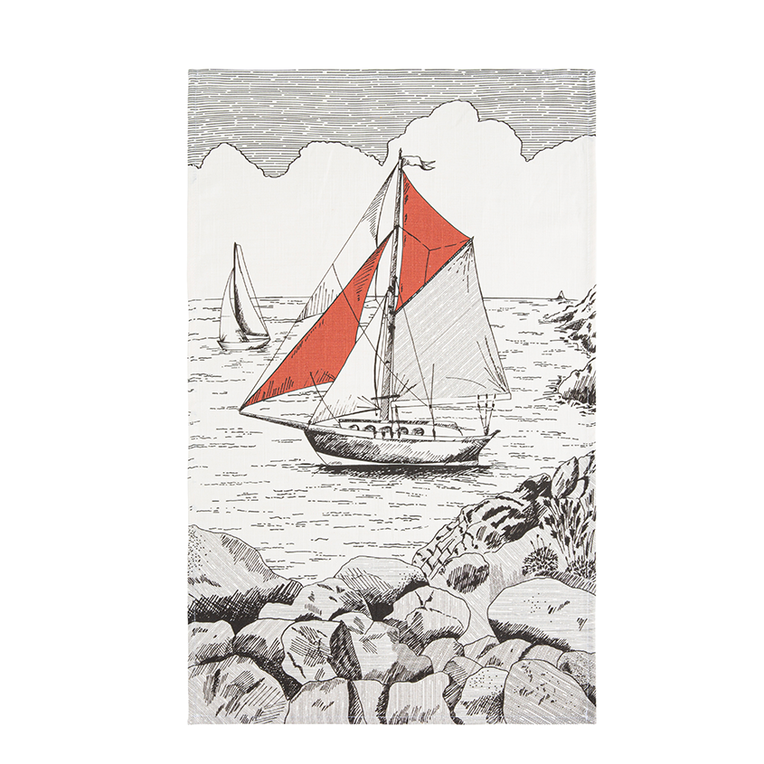 A black and white tea towel with an illustration of a sailboat with a red sail on it.