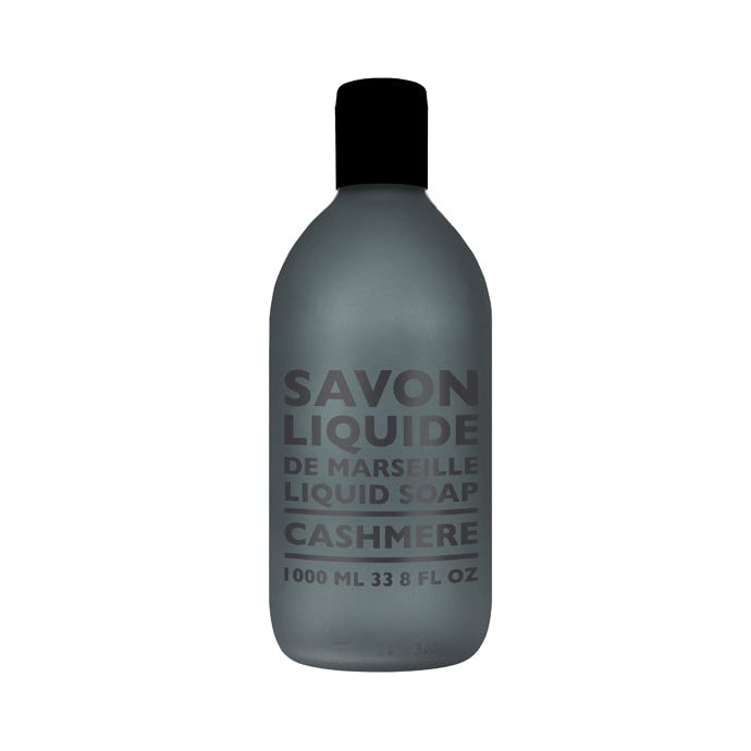 A gray plastic bottle with black cap labeled 'SAVON LIQUIDE DE MARSEILLE CASHMERE' indicating it is a liquid soap refill.