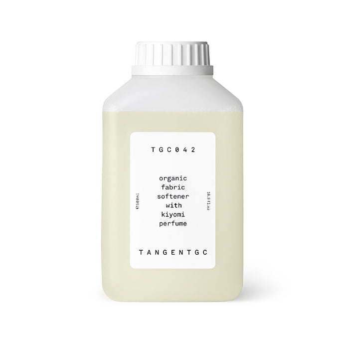 A bottle of Tangent GC organic fabric softener with Kiyomi perfume, primarily white in color with a label that includes the product name and the scent marked as Kiyomi.