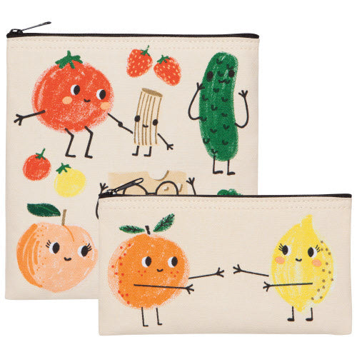Two portable food bags with colorful fruit and vegetable characters such as a tomato, lemon, and cucumber illustrated on them.