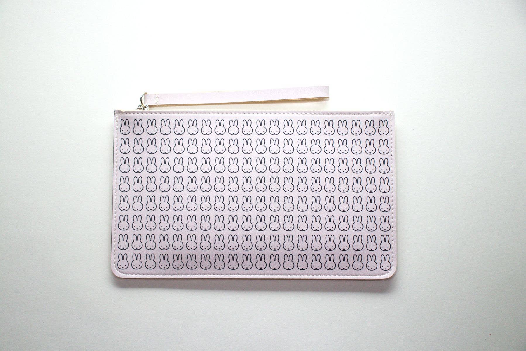 White pouch with bunny pattern on a white background