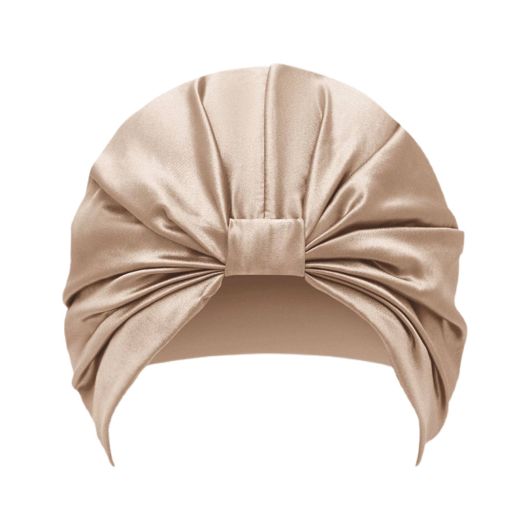 Beige hair turban on a white background
