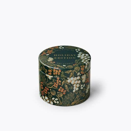 Decorative cylindrical tin with floral design and 'Holiday Edition' text on a white background