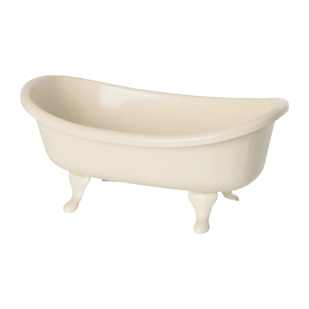 Beige bathtub with claw feet on a white background