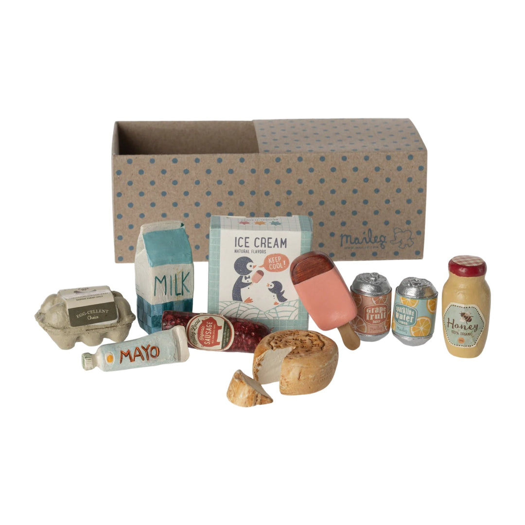 Collection of miniature food items and a box with a polka dot pattern on a white background