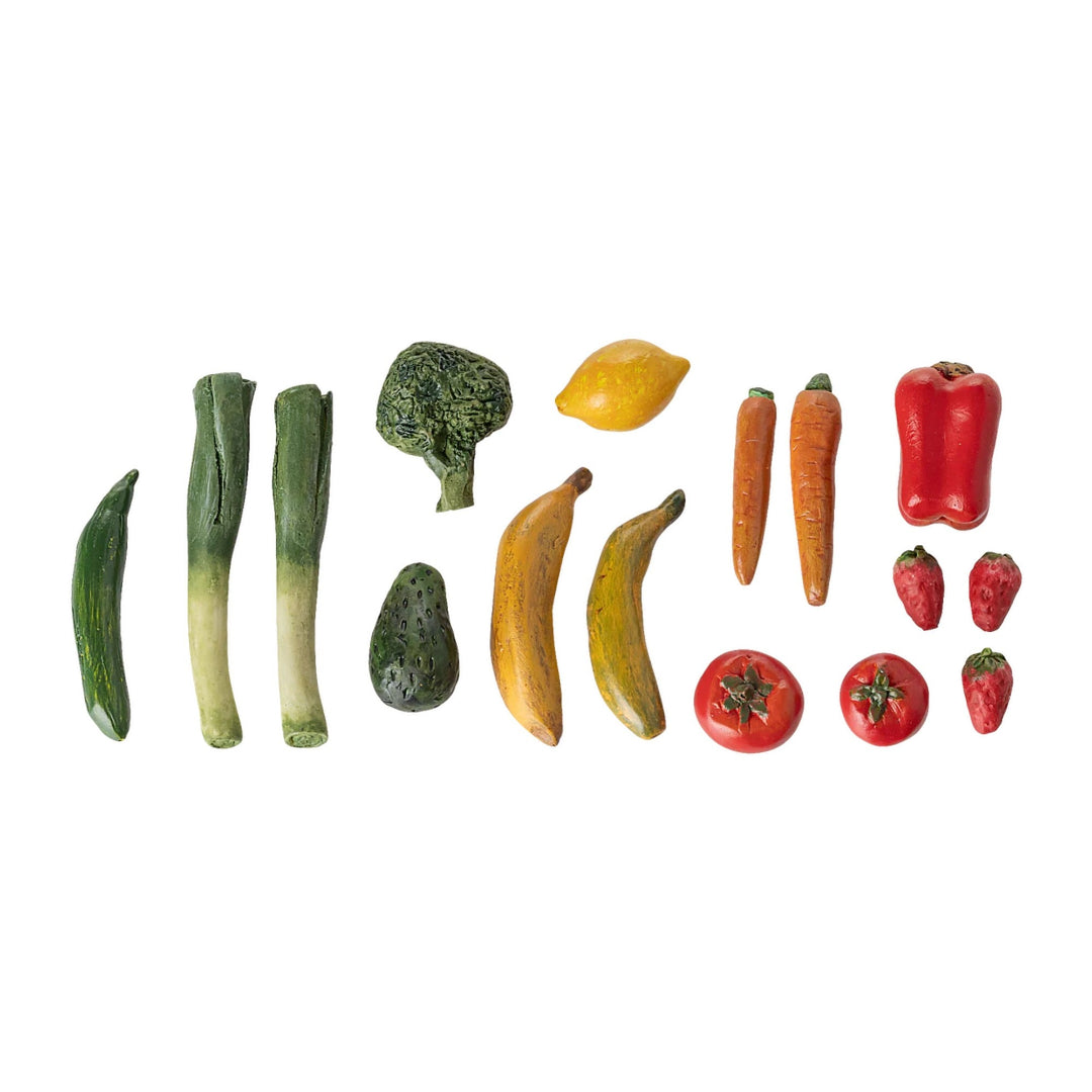 Set of toy vegetables and fruits on a white background
