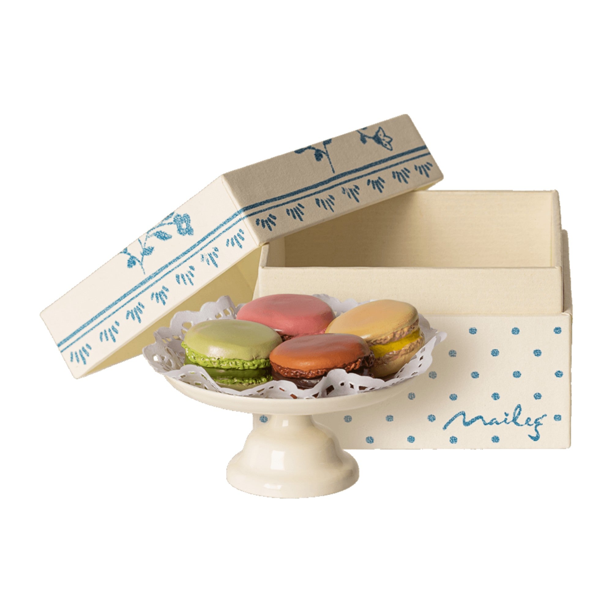 Decorative box with colorful macarons on a white background
