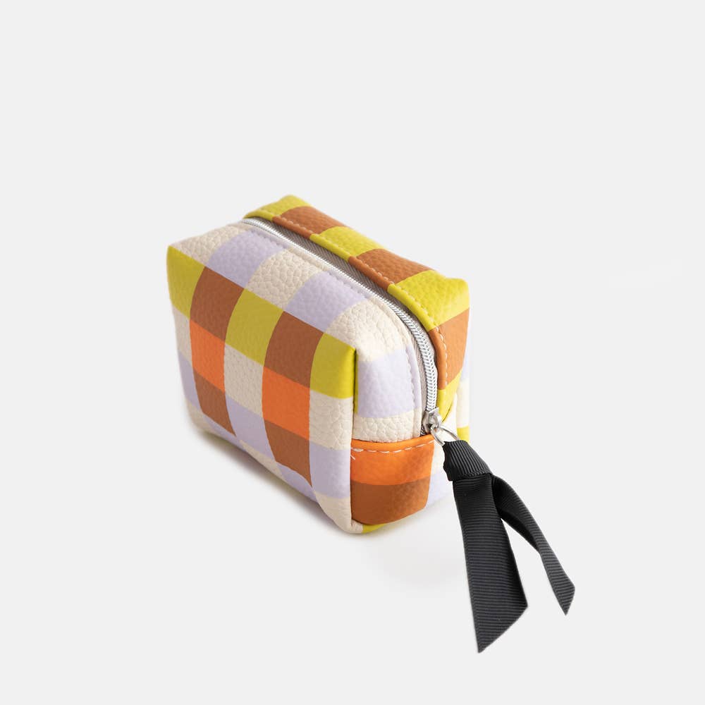 Colorful checkered pouch with a black ribbon on a white background
