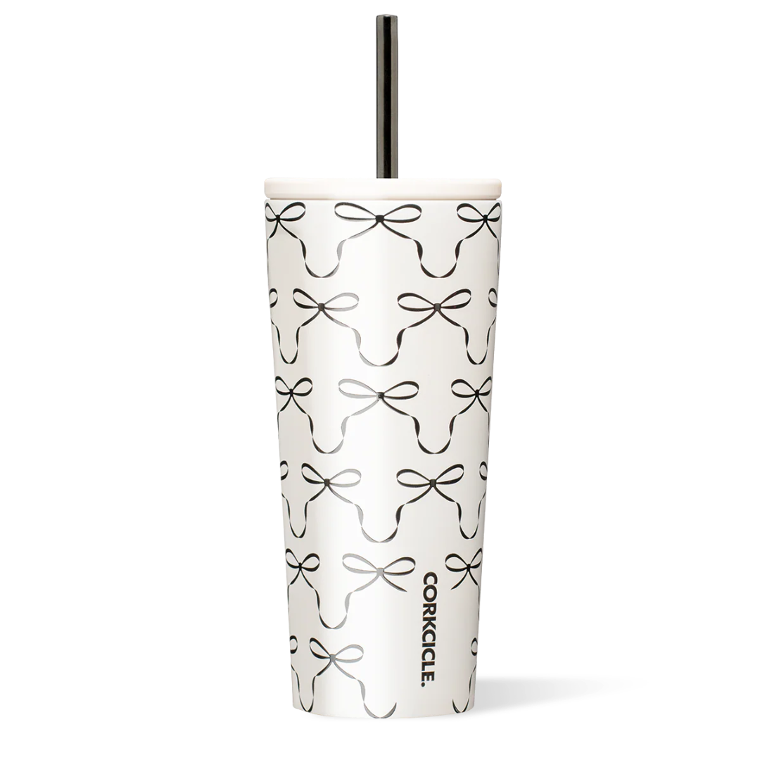 Tumbler with black bow pattern on a white background