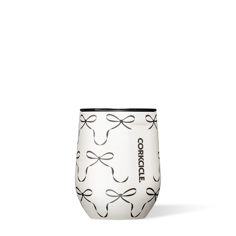 Stemless wine glass with bow pattern and Corkcicle logo on a white background