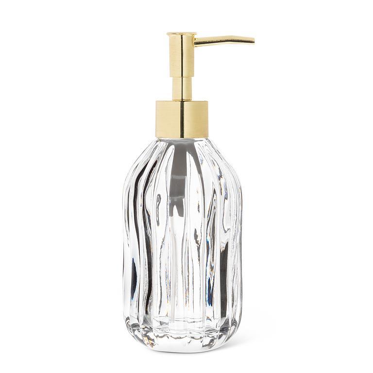 Clear glass soap dispenser with gold pump on a white background
