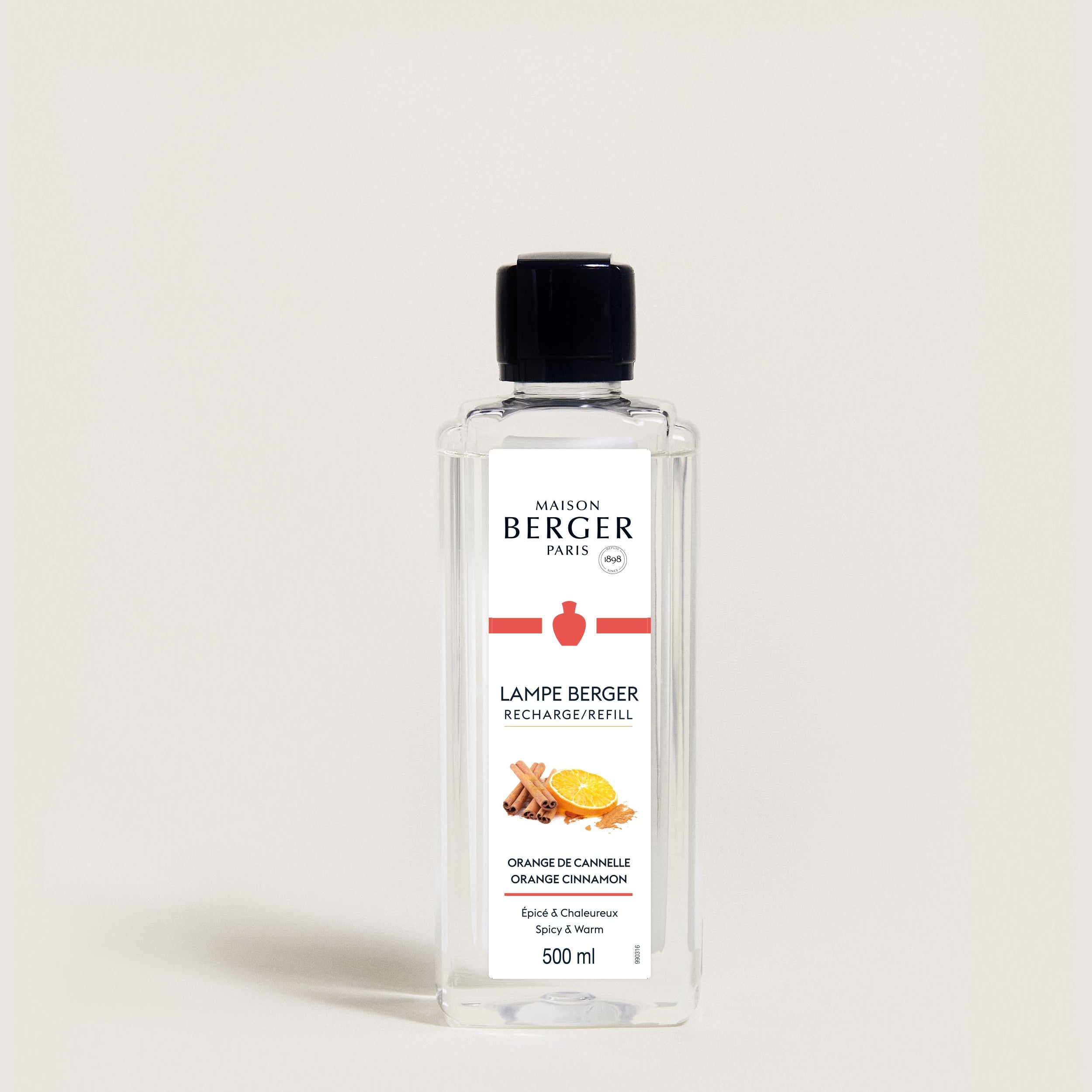 Bottle of Maison Berger lamp refill on a light gray background