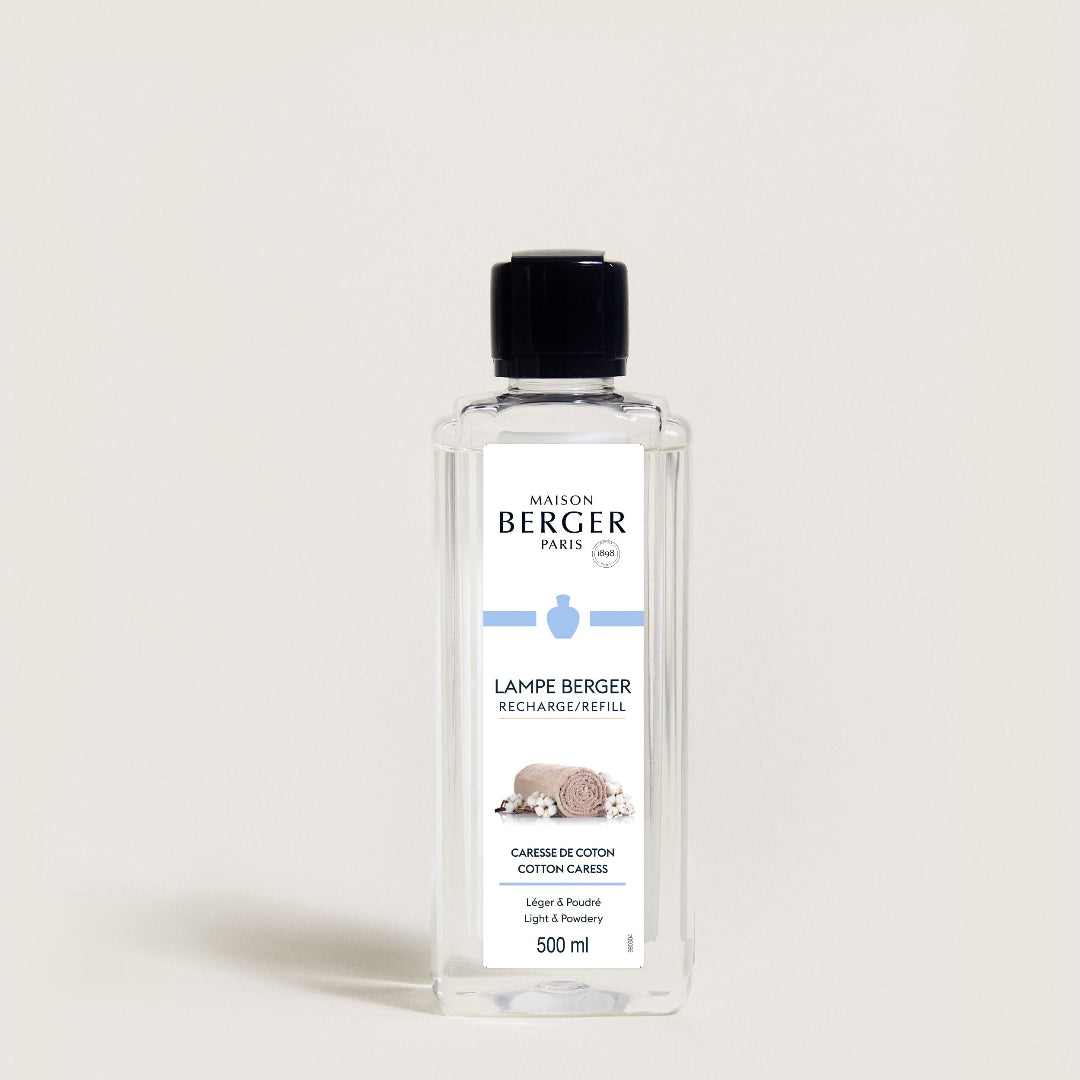 Bottle of Maison Berger lamp refill on a light background